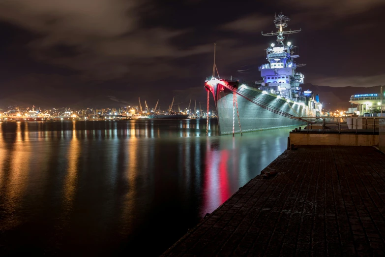 the big boat is in the harbor in the evening