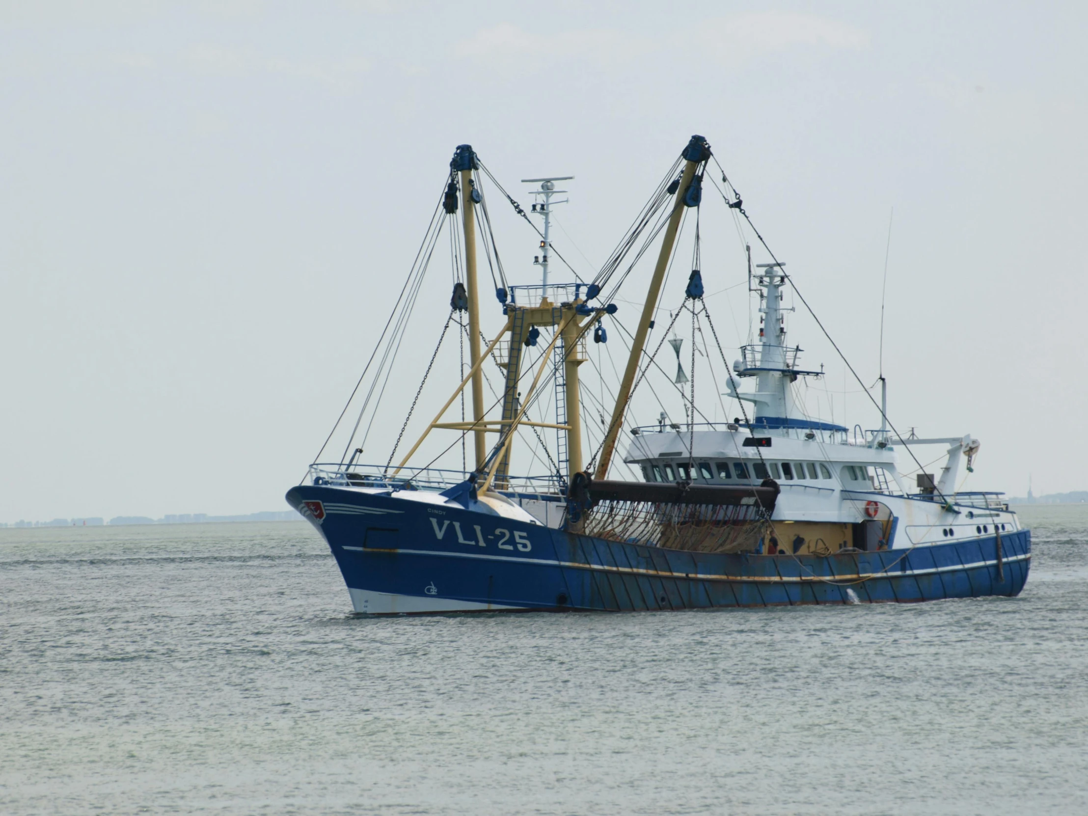 two large boats out in the water