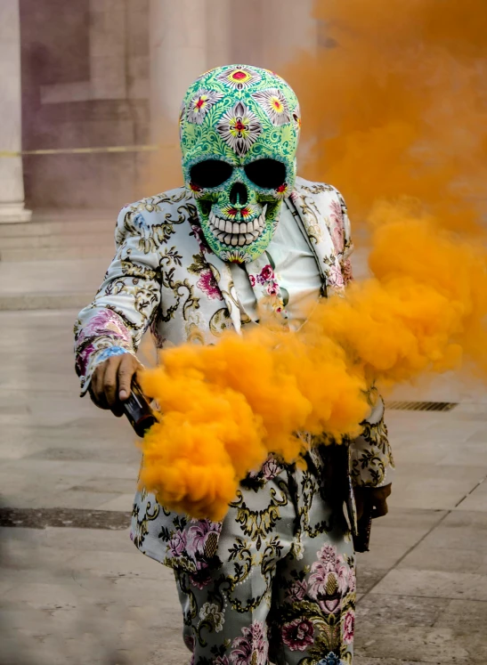 a man in a skeleton suit holding a gun