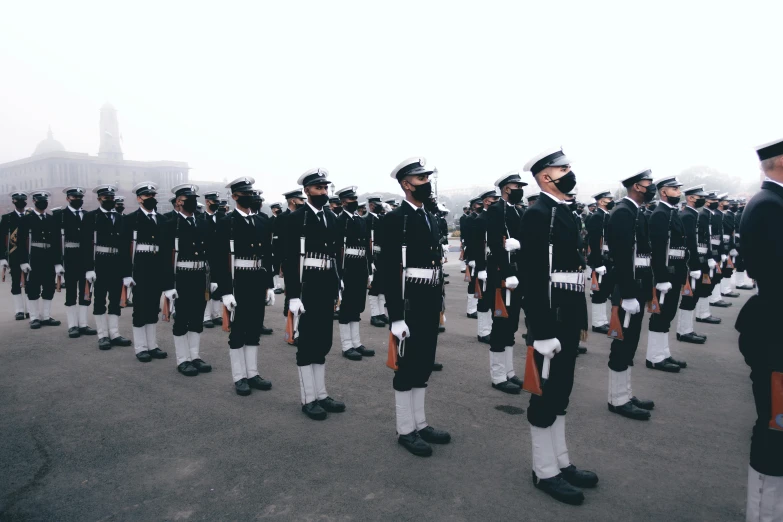 a military band performing on top of a cement surface