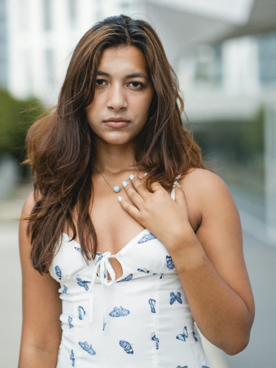 a woman in a blue and white dress looking angry