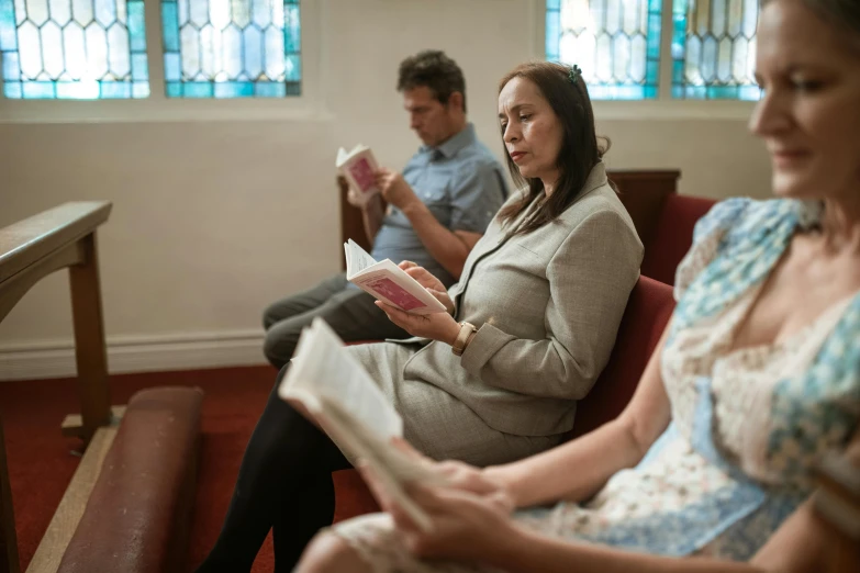 a woman sitting next to a man in a church