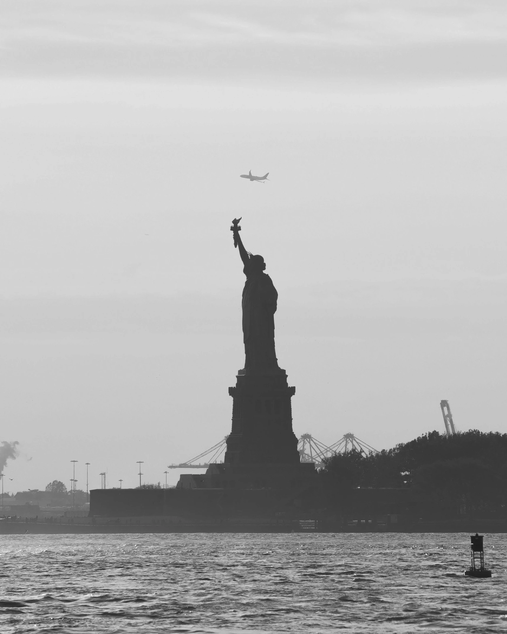 the statue of liberty stands tall above the water