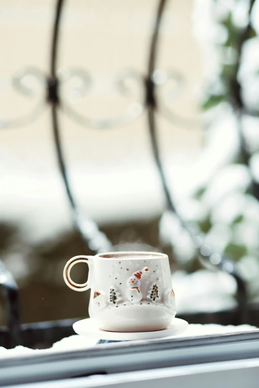 coffee cup sitting on top of a white napkin