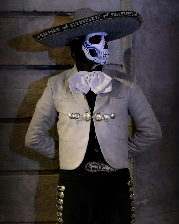 the mexican skull in the suit is ready to perform a trick