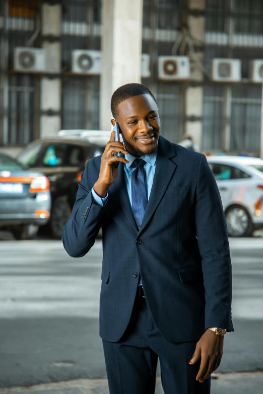 a man in a suit talking on the phone