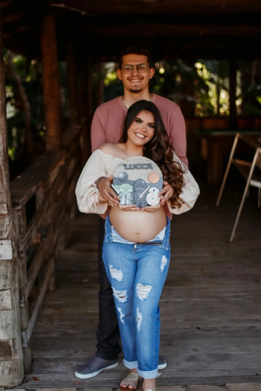 an image of two pregnant woman standing on the bridge