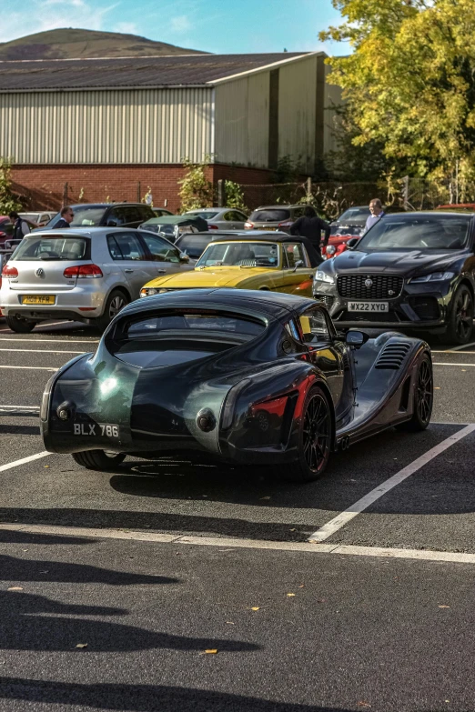 two cars parked near each other in a lot