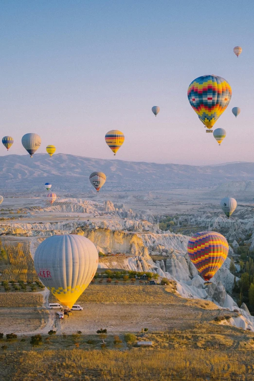 several different types of  air balloons are flying high up in the air