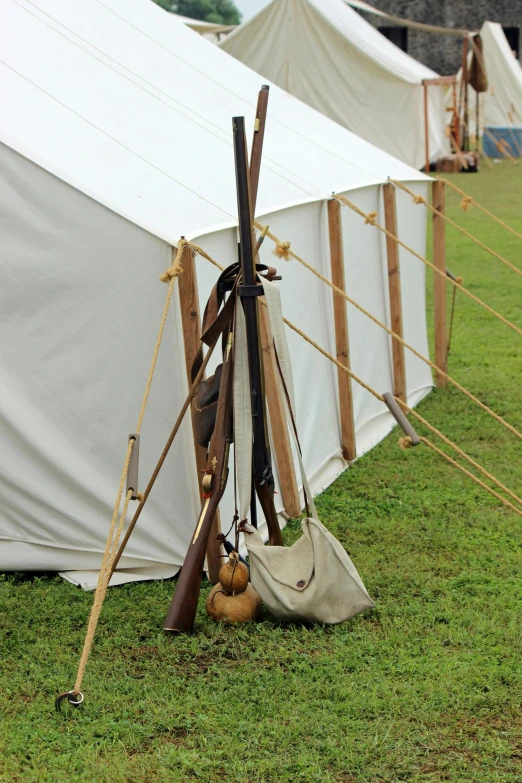 a pole with a bag and wooden poles