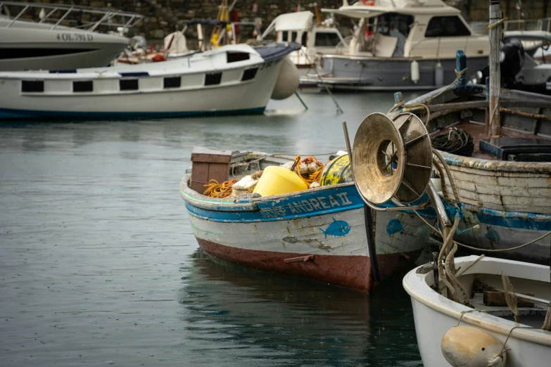 boats in the harbor with many different things on display