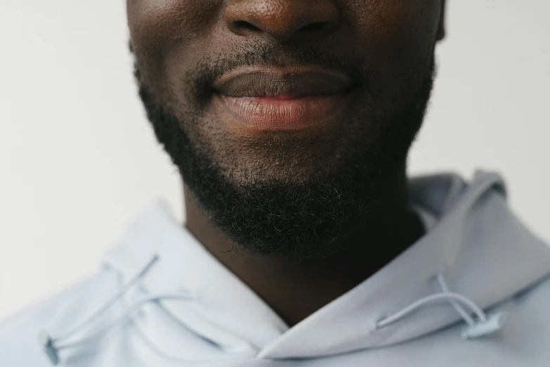 a man in white shirt looking straight ahead