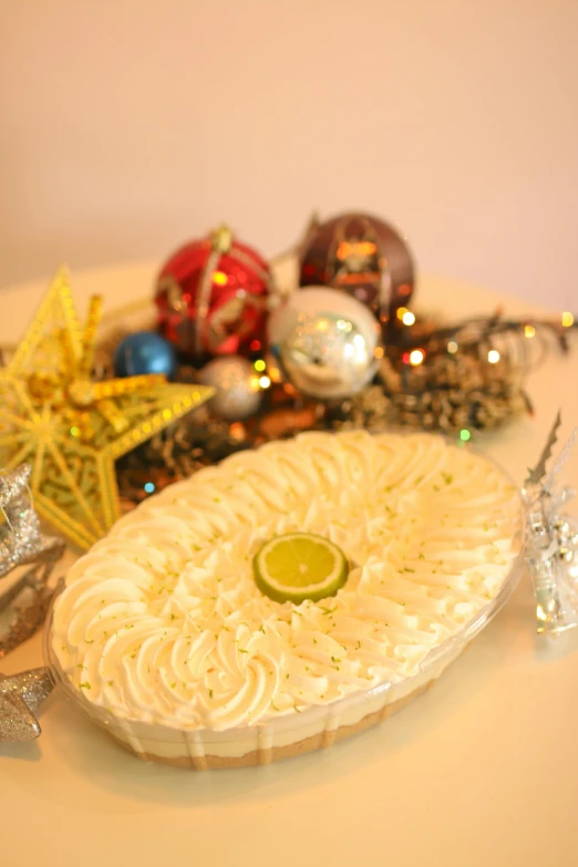 a dessert on a plate is sitting next to decoration