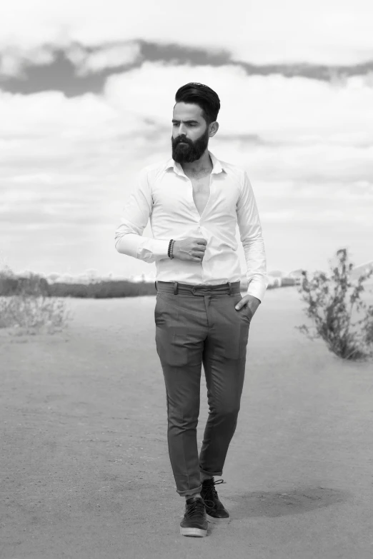 a man with a beard wearing a shirt and tie