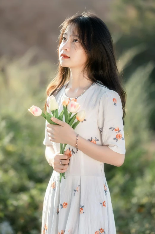 an asian woman with long hair holding roses