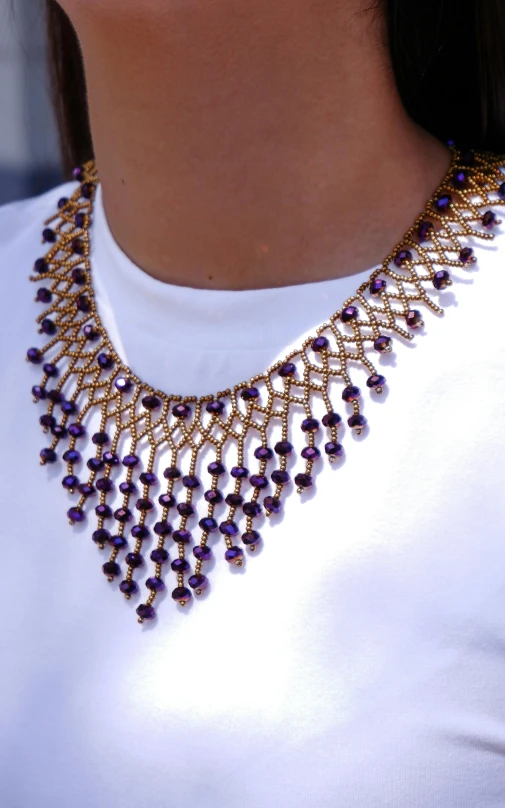 closeup of a very ornate necklace from an elaborate costume