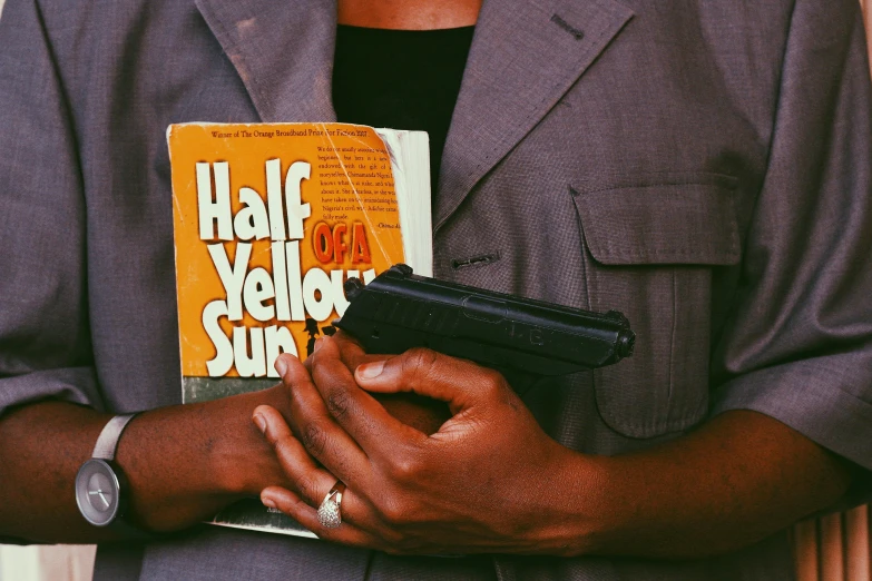 a close up of a person holding some books