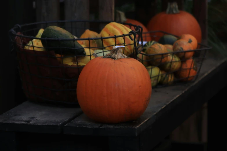 there are two orange pumpkins in the basket