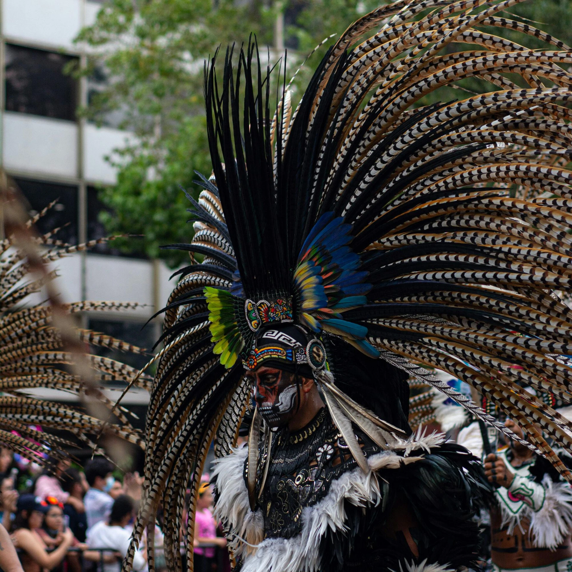 the parade includes native americans, like this dancer