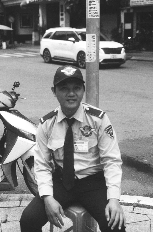 a police officer is posing on a sidewalk