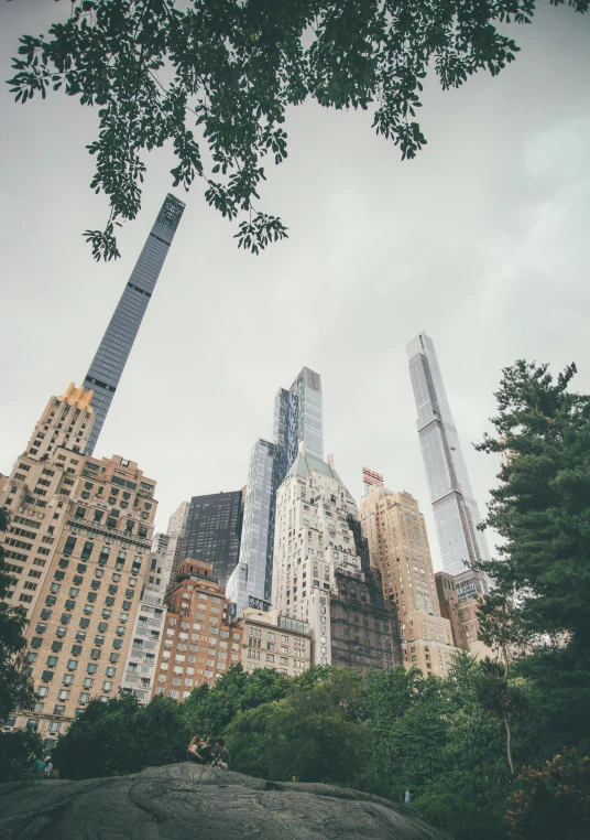 tall buildings towering over a city skyline in the daytime