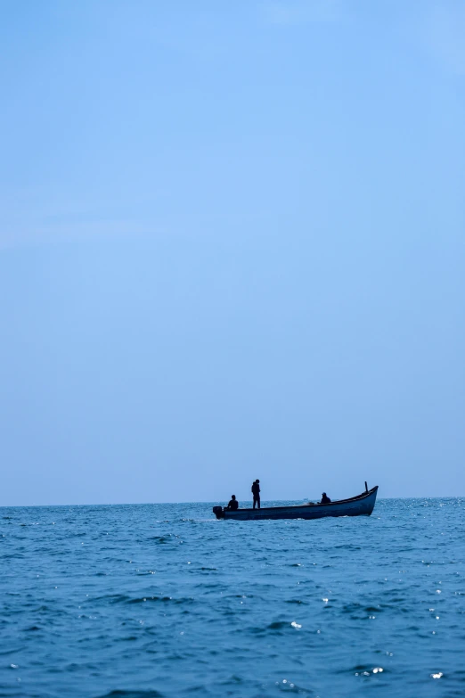 a small fishing boat is seen in the water