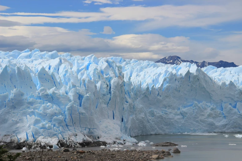 a large glacier on the side of a mountain