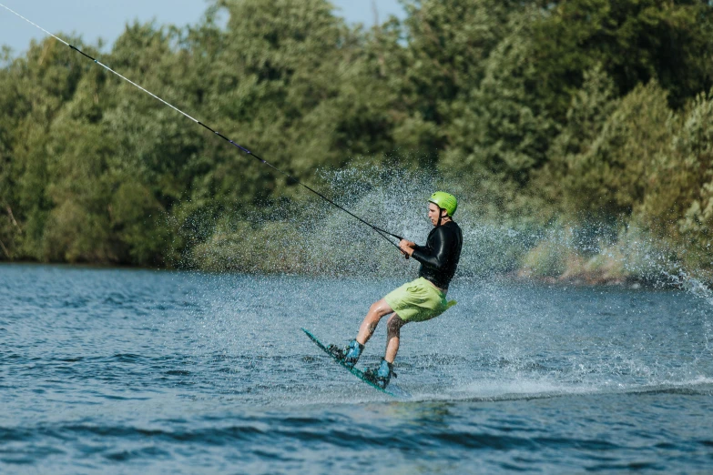 the water skier is making an aerial trick on the water