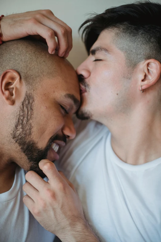 two men laughing together on the side