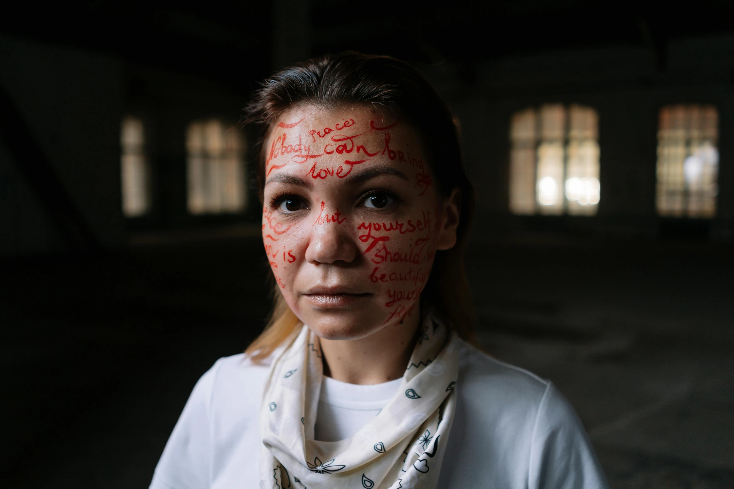 a girl with some type of skin on her face and all over red paint