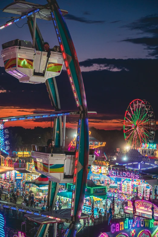 a ferris wheel at night in an amut park