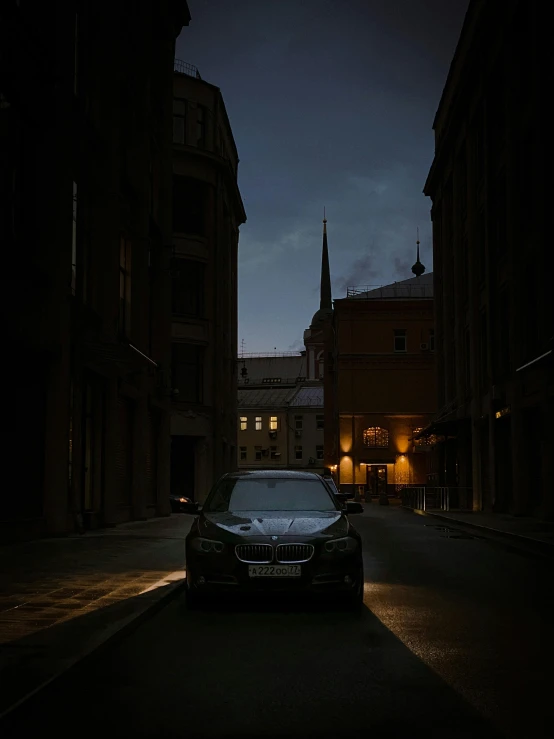 a car parked in an alley at night