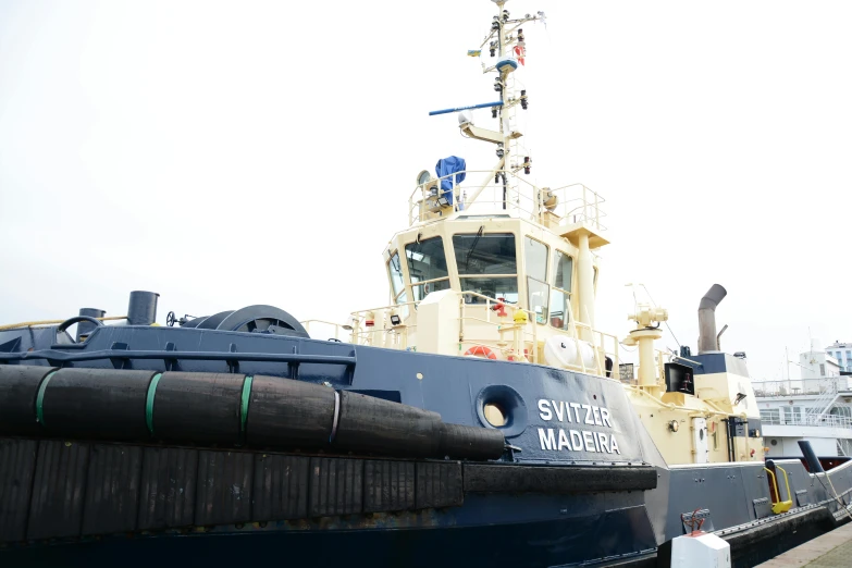 tug boat in the foreground with tugboat on the right side