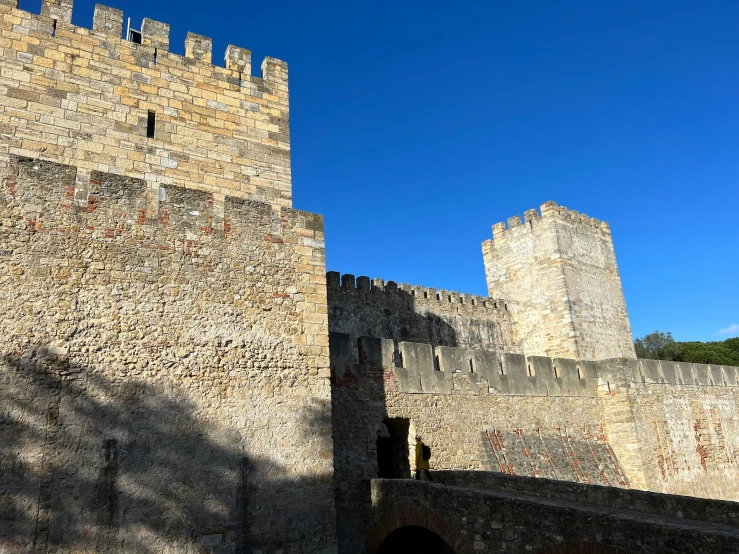 an old castle is in the shadow