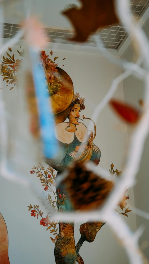 reflection of wall and floor in mirror, with guitar's head visible