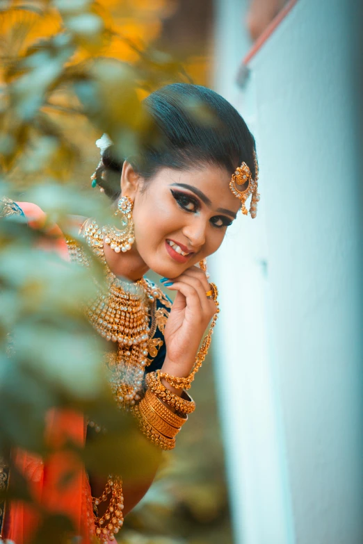 a woman wearing some fancy jewelry poses for a po