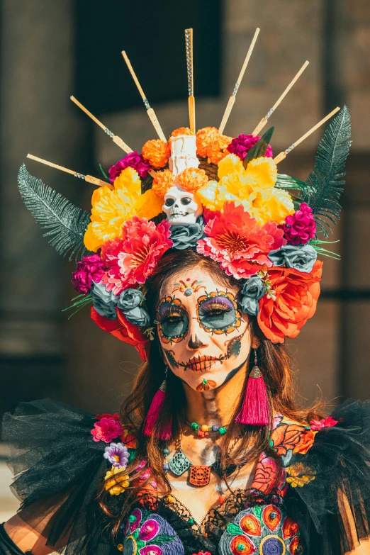 a woman wearing colorful makeup and face art