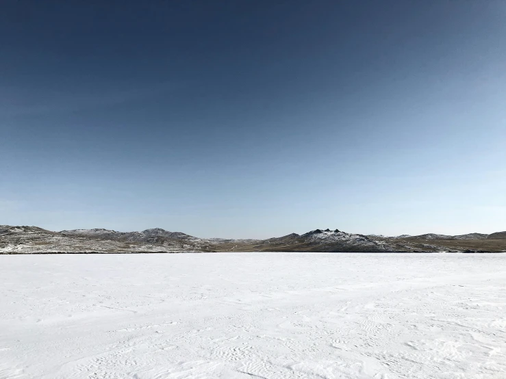 the blue sky and a large white landscape