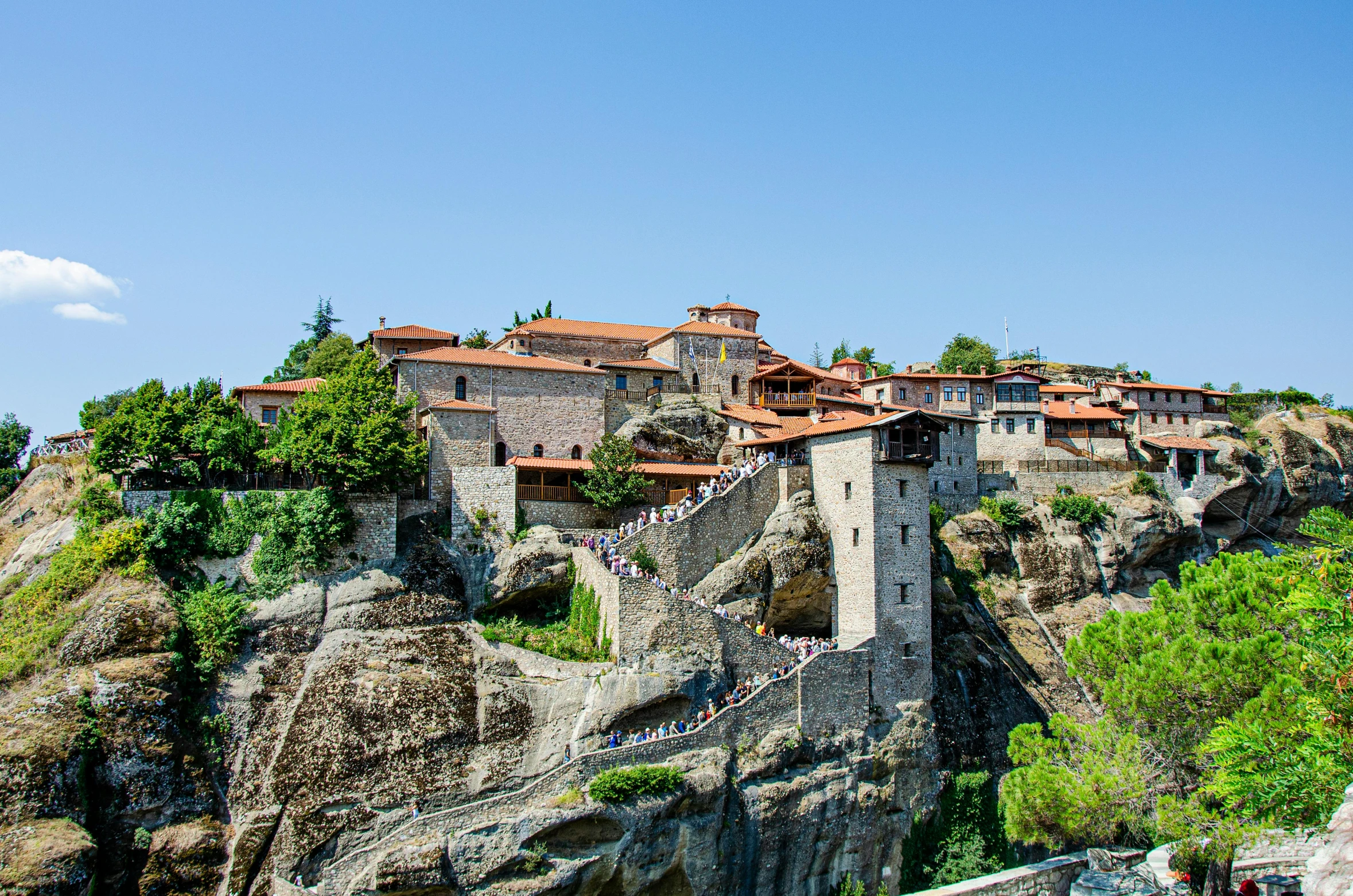 a castle perched atop the rocky hill above town