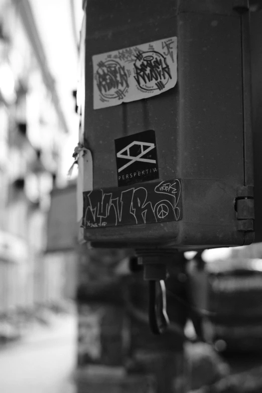 black and white image of a box with graffiti on it