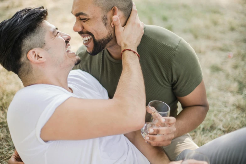 two men sharing a laugh together at the same time