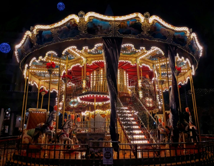 the carousel has lights in it and is brightly lit