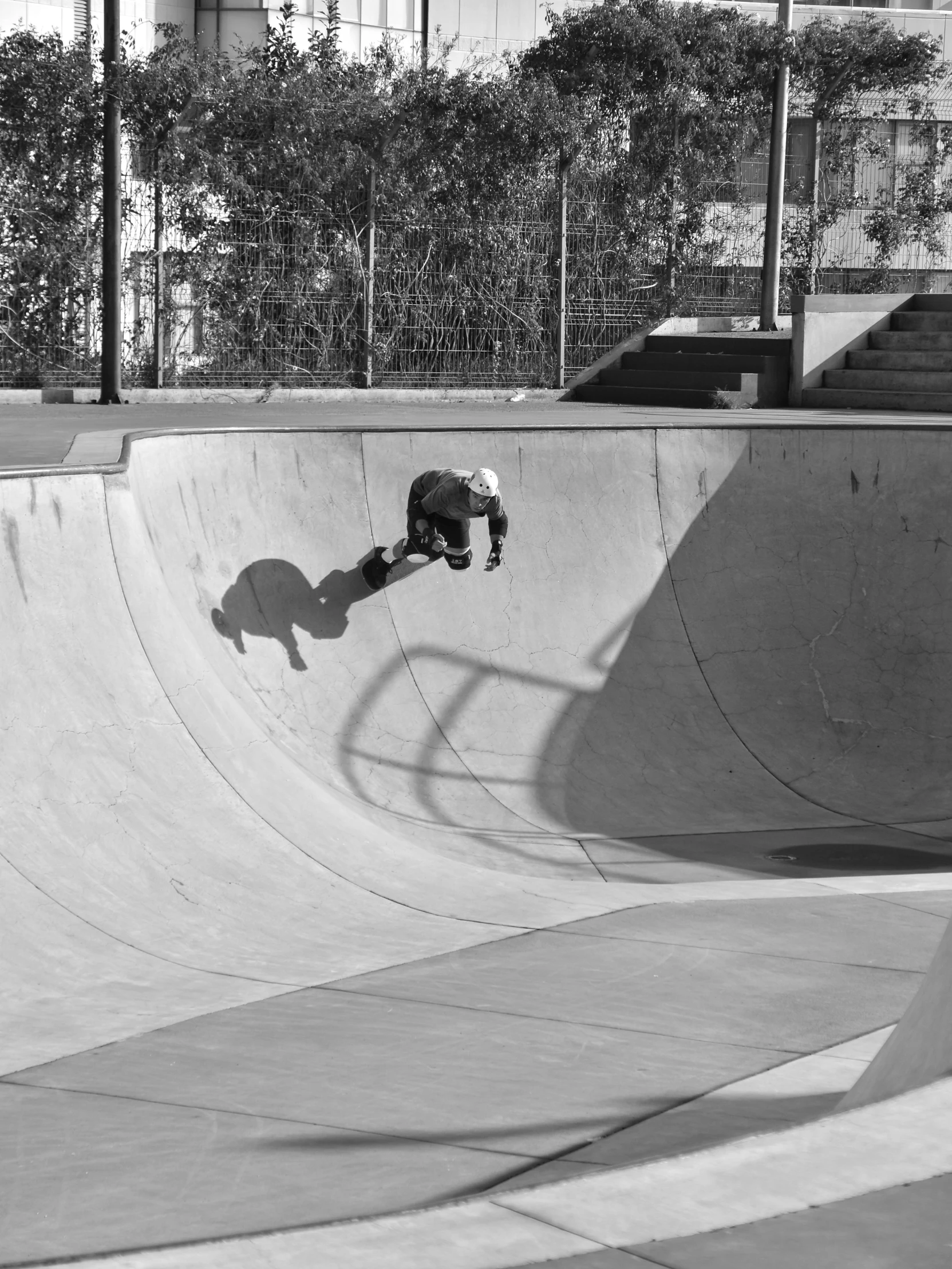 the young man is on his skate board at the skate park