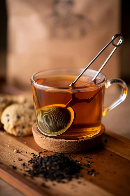 a cup of tea and cookies on a  board