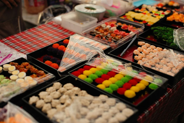 many different colors of candies laid out on a table