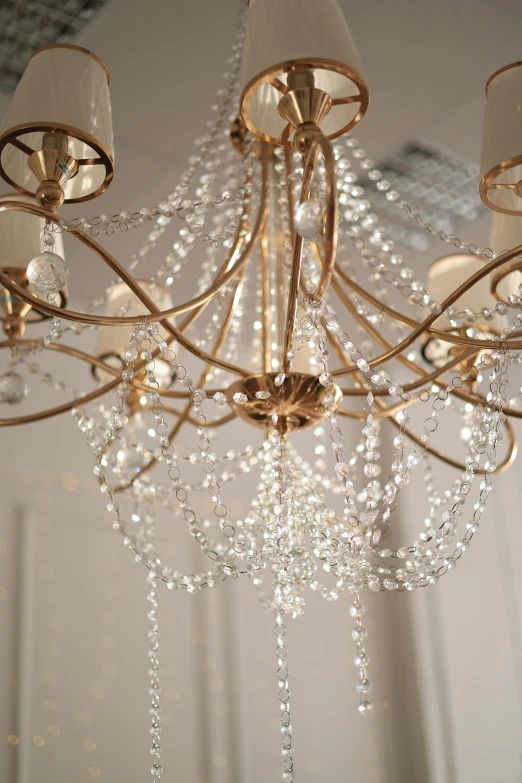 the light fixtures in a chandelier hang from the ceiling