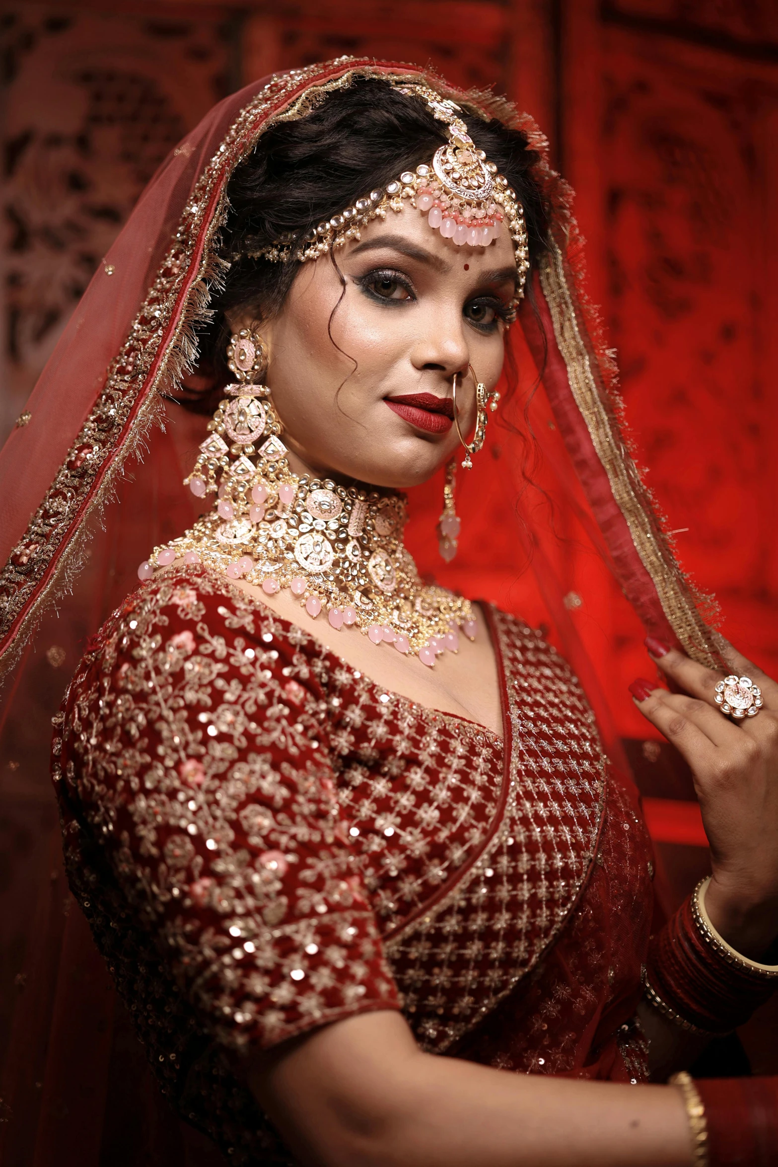 a young woman poses in her bridal dress