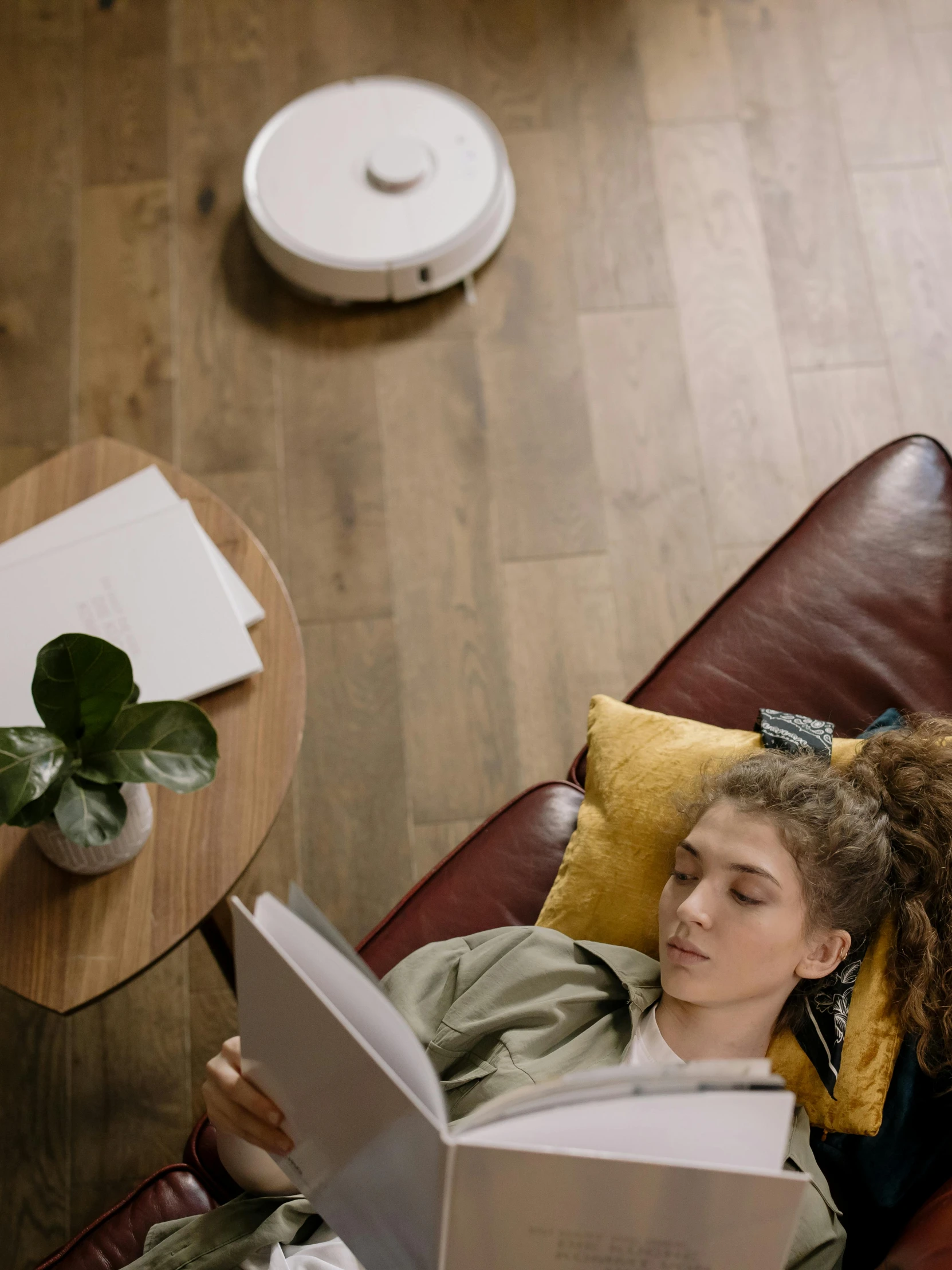 a person sitting in a chair reading a book