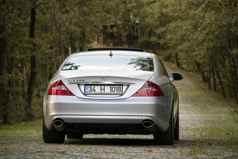 car in the forest, with an alarm clock