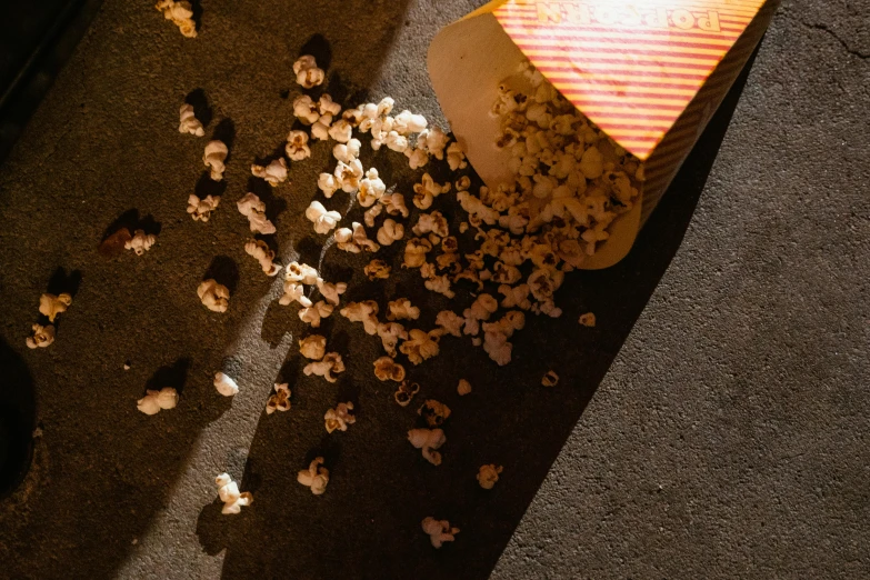 a bag full of popcorn being smashed on the street